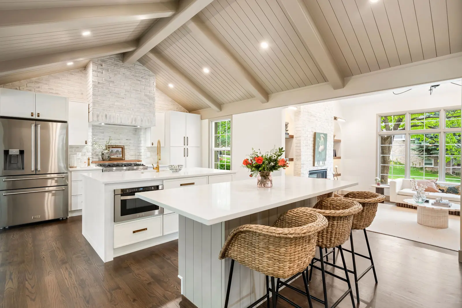 Kitchen island in a vaulted white kitchen