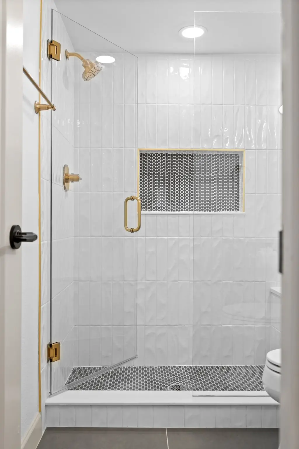Walk-in shower with marble walls